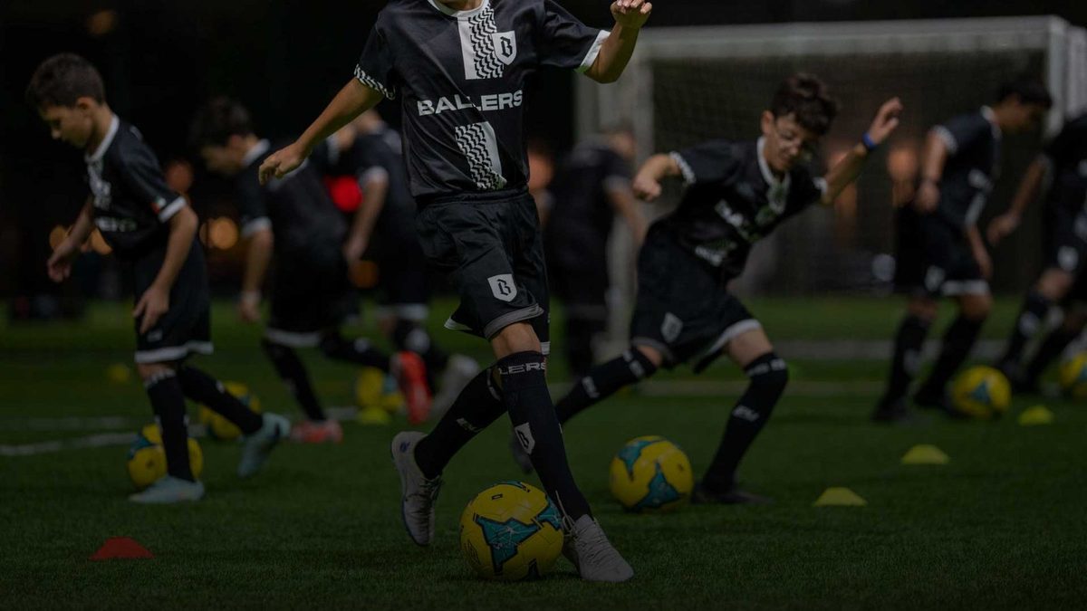 A squad working through a training drill in Ballers kit